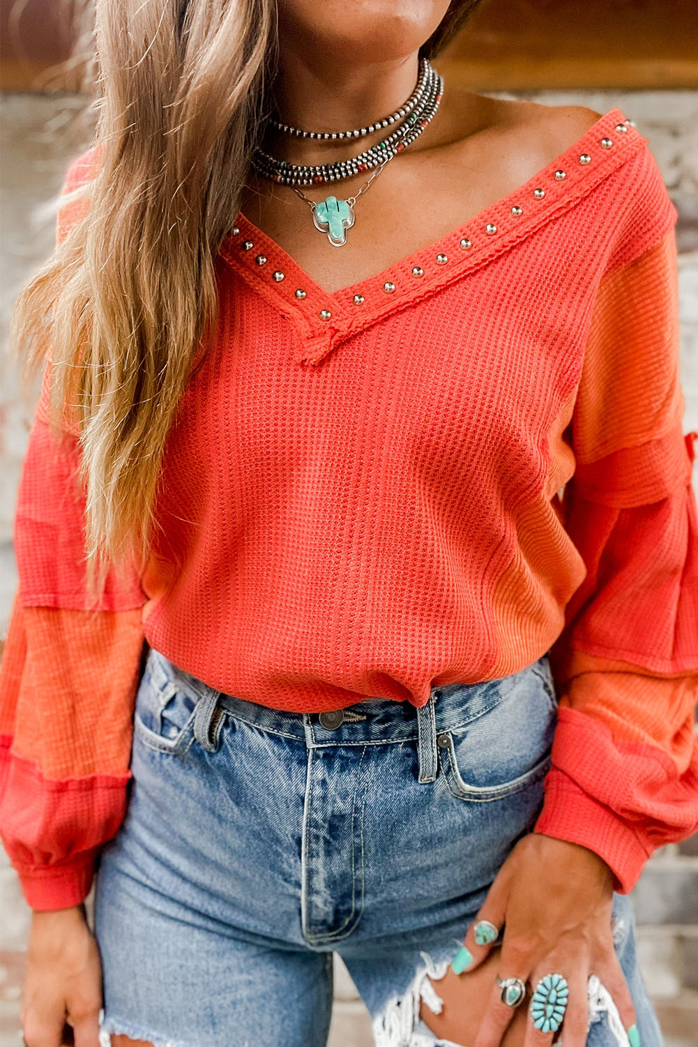 Fiery Red Studded V Neckline Exposed Seam Textured Knit Top