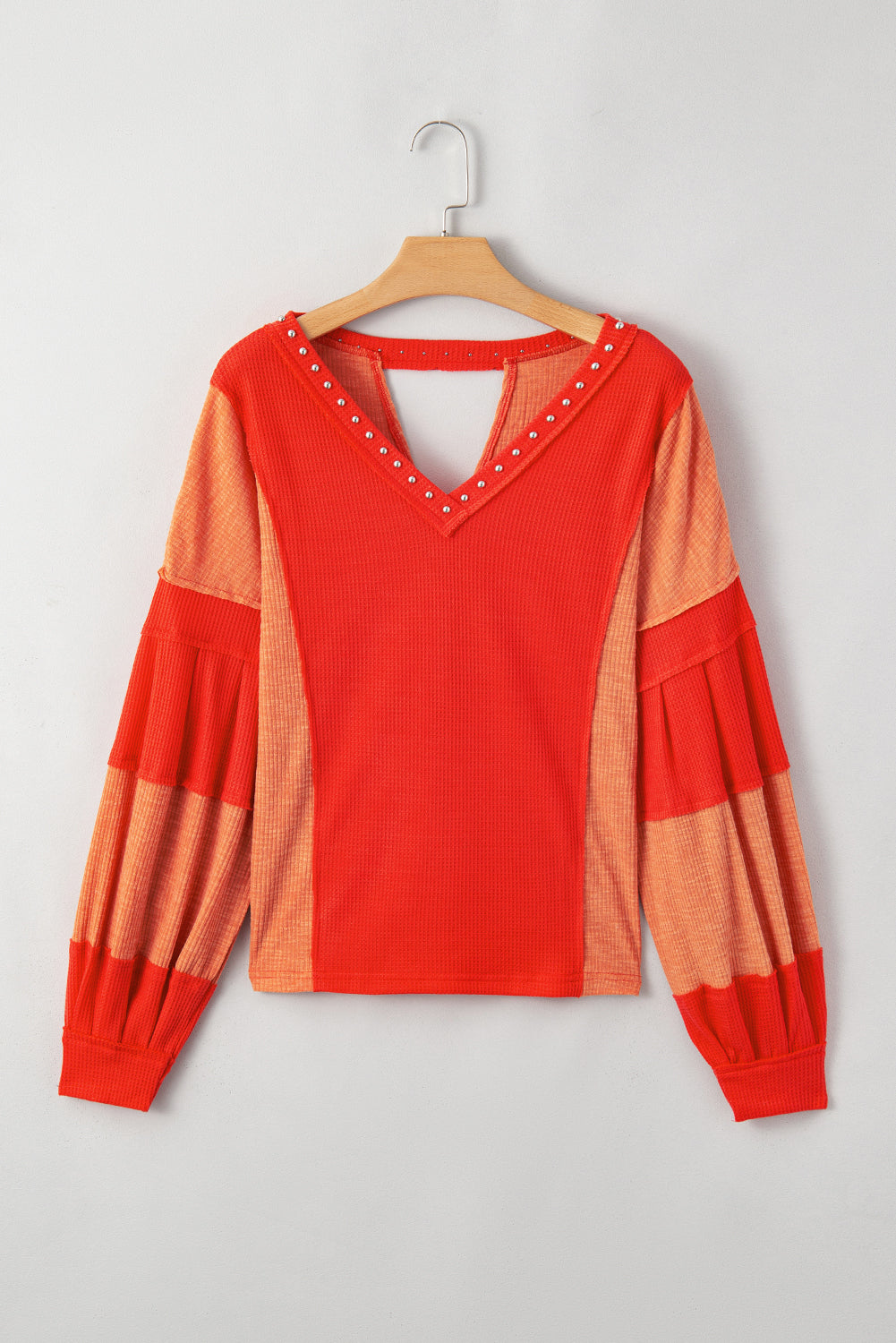 Fiery Red Studded V Neckline Exposed Seam Textured Knit Top